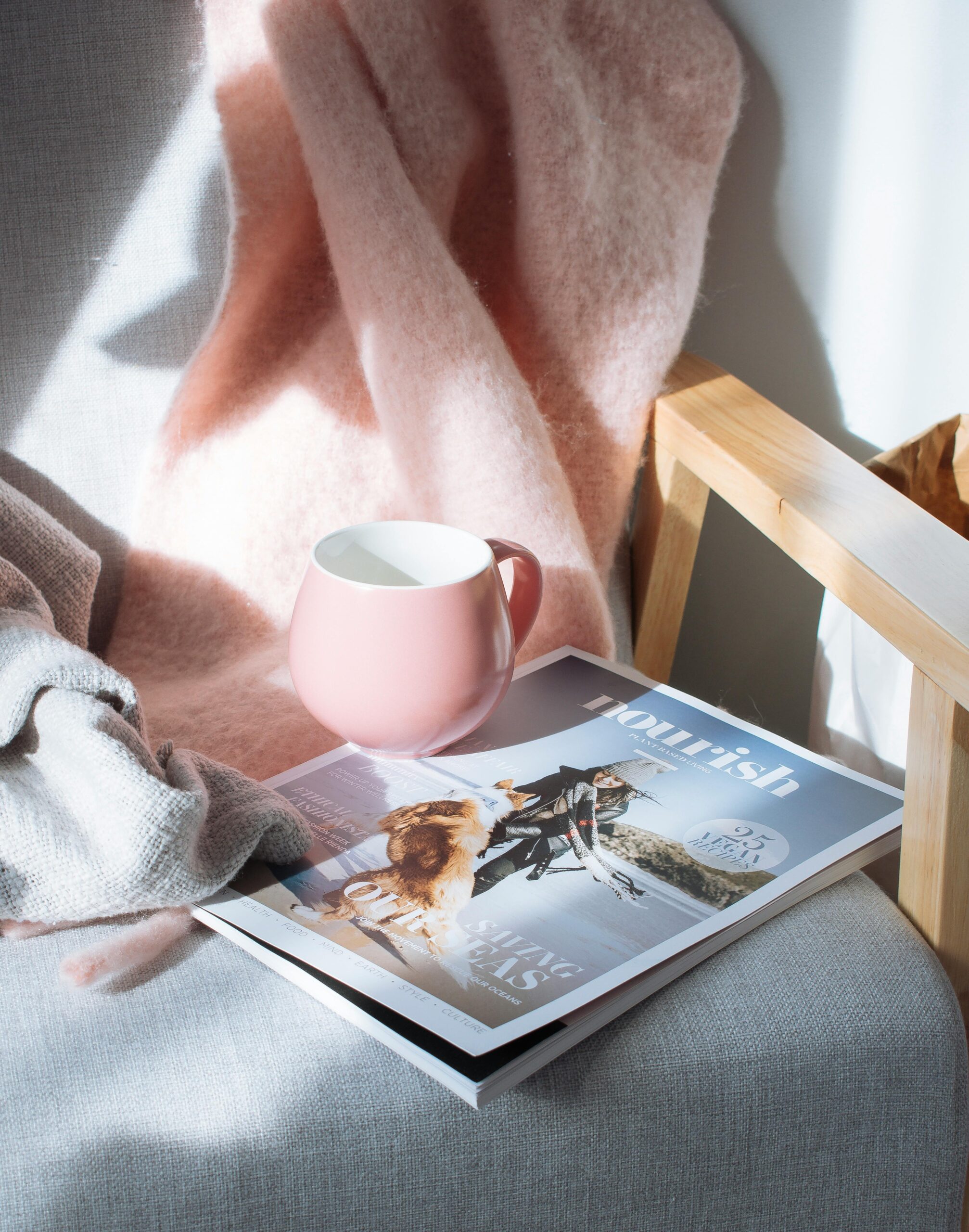 Cup and magazine placed on a chair